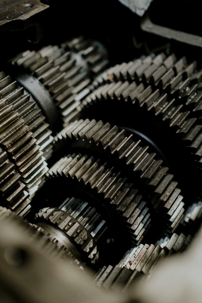 Detailed close-up of metal gears inside a machine showcasing precision engineering.